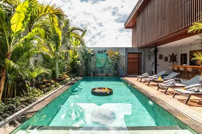 a swimming pool in a villa with a resort at PROMO Luxury 4bd Villa in HotSpot with Huge Private Pool in Seminyak