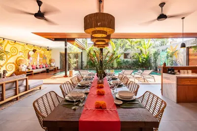 a dining room with a long table and chairs at PROMO Luxury 4bd Villa in HotSpot with Huge Private Pool in Seminyak