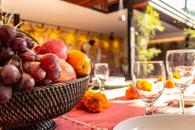 a basket of fruit on a table with wine glasses at PROMO Luxury 4bd Villa in HotSpot with Huge Private Pool in Seminyak