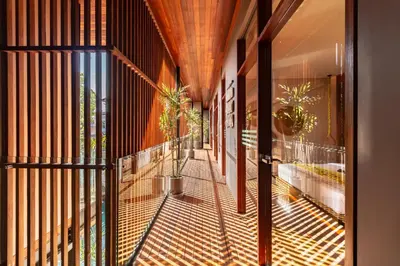 an external view of a building with a balcony with potted plants at PROMO Luxury 4bd Villa in HotSpot with Huge Private Pool in Seminyak