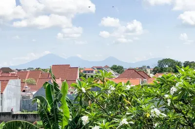 a view of a city with mountains in the background at Spacious and Quiet 2 Bd Villa with Pool and Projector in Kerobokan