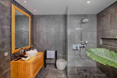 a bathroom with a sink and a shower at THE MILAGRO VILLA in Canggu