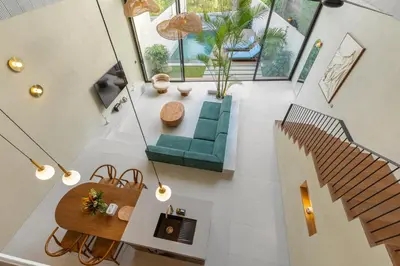 an overhead view of a living room with a green couch at ASAI Village in Jimbaran