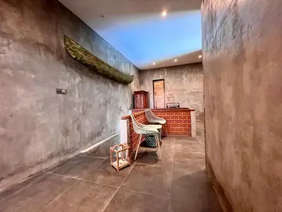 a room with a desk and a chair in it at Rumah Hadeka Petitenget in Seminyak