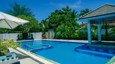 a swimming pool with a gazebo at Aldeoz Villa Nusa Dua in Nusa Dua