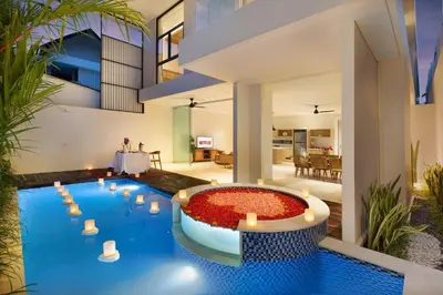 a pool in the middle of a house at Eight Palms Villa Seminyak by Ini Vie Hospitality in Seminyak