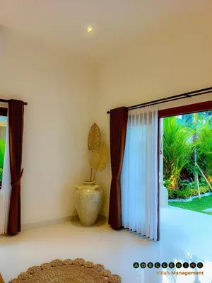 a room with a window with a plant in a vase at CASA LUWIH Newly Renovated 2BR Villa with Private Pool in Seminyak in Seminyak