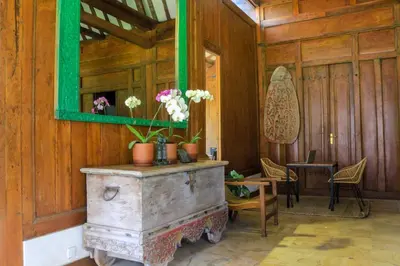 a room with an old stove with flowers on it at Chanteak Bali - Stone House 2 in Jimbaran