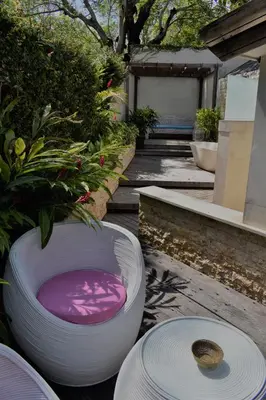 a couple of large white bowls sitting on the ground at Chanteak Bali - Teak House 1 in Jimbaran