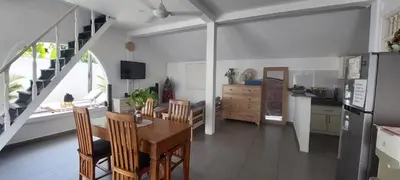 a kitchen and dining room with a table and chairs at Villa Olivia in Seminyak