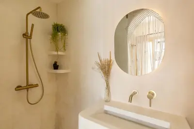 a bathroom with a sink and a mirror at Villa Canggu Beach Coconut - walking distance to Beach & Bars! in Canggu