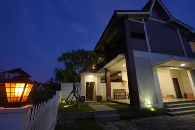 a house with a light on the side of it at night at Sunkiest House Canggu in Canggu