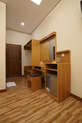 an empty room with a desk and a mirror at Sunkiest House Canggu in Canggu