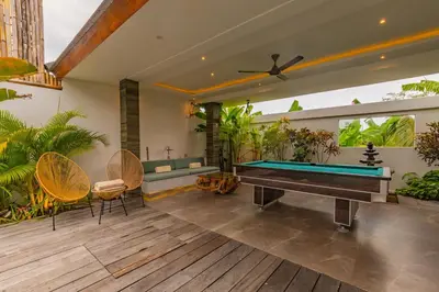 a pool table in the middle of a patio at Hedonia Luxury Villas in Seminyak
