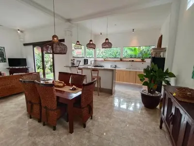 a kitchen and dining room with a table and chairs at Villa MONTI - LEGIAN - SEMINYAK - Lovely 2 Bedroom Villa - Great Location ! in Seminyak