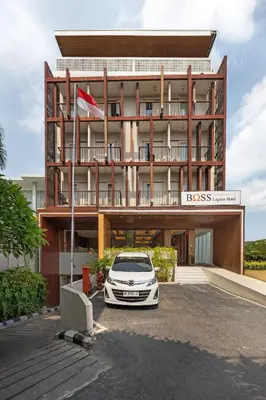 a car parked in front of a hotel at Boss Legian Hotel Powered by Archipelago in Legian