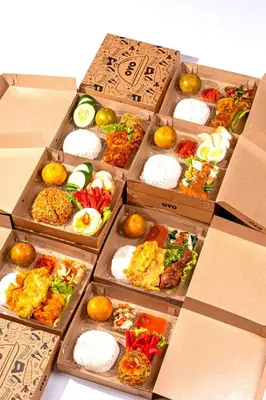 a group of boxes filled with different types of food at OYO Collection O 91125 Puri Dewa Bharata in Jimbaran