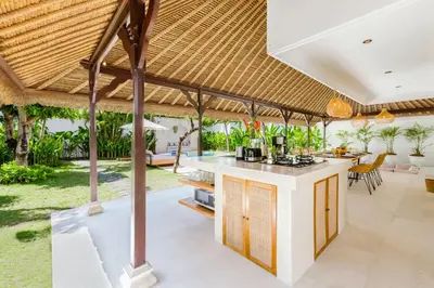 an outdoor kitchen and dining area of a villa at Villa Chandika - 4 BDR Villa with private Pool, walk to the beach in Seminyak