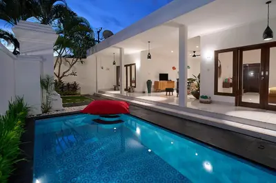 a swimming pool in the backyard of a house at Casa Jinah 1 I Simply Modern Twin Villas (2BR) with Private Pool in Seminyak