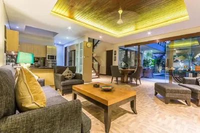 a living room with a couch and a table at Villa Lisha in Canggu