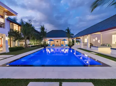 a swimming pool in the backyard of a house at Villa Windu Asri in Seminyak