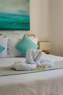 a towel animal made out of towels on a bed at Central Seminyak, 3BR, Ensuites, Sleep 6, Peaceful in Seminyak