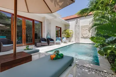 a villa with a swimming pool and a patio at Central Seminyak, 3BR, Ensuites, Sleep 6, Peaceful in Seminyak