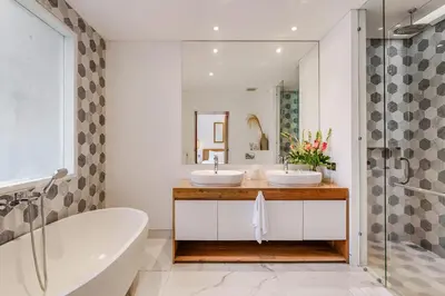 a bathroom with two sinks and a tub and a shower at Villa Vana, Sitara Villa Group in Seminyak