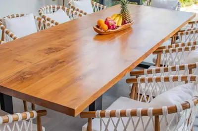 a wooden table with a bowl of fruit on it at Villa Mango 2 - Amazing 4-bdr Villa in Berawa ! PERFECT LOCATION in Canggu