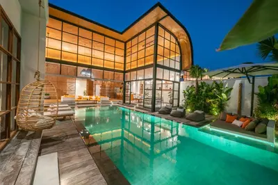 an indoor pool in a house with a house at Villa Mango 2 - Amazing 4-bdr Villa in Berawa ! PERFECT LOCATION in Canggu