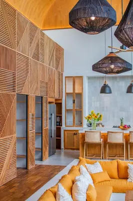 a living room with a couch and a kitchen at Villa Mango 2 - Amazing 4-bdr Villa in Berawa ! PERFECT LOCATION in Canggu