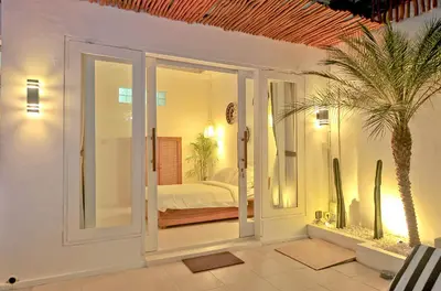 a room with a bedroom with a bed in it at Villa Elijah in Seminyak