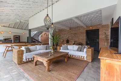 a living room with two couches and a table at Villa Madura DREAM 3bdrs Central Seminyak in Seminyak