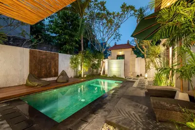 a swimming pool in the backyard of a house at Villa Banua Seminyak in Seminyak