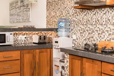 a kitchen with a blender on top of a counter at Relax Bali Villas in Legian