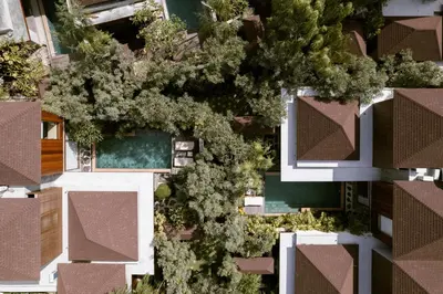 an overhead view of a building with a tree at Munno Villa in Canggu