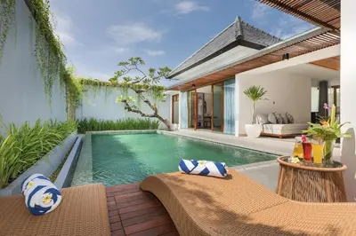 a swimming pool in the backyard of a villa at Fenosa Seminyak Villas in Seminyak