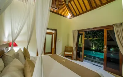a bedroom with a bed and a large window at Villa MD 3 bedroom, Sunny Pool in Eat st location in Seminyak