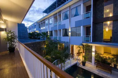 a balcony view of a building with plants at M Suite Bali in Seminyak