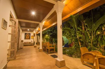 a hallway of a house with a table and chairs at Bale Seminyak in Seminyak