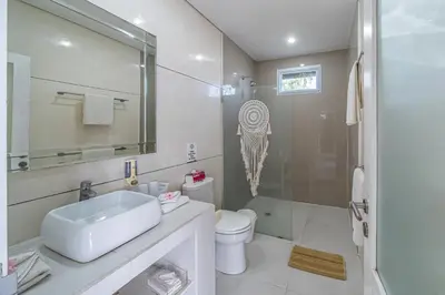 a bathroom with a sink and a toilet and a shower at VILLA BALI OM CENTER - Best Location, Beautiful Villa Near the Beach in Canggu