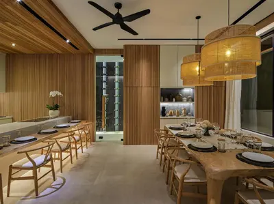 a dining room with a long table and chairs at Villa Nini Elly by Elite Havens in Canggu