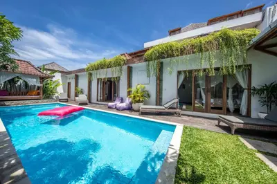 a swimming pool in the backyard of a house at Elvano villa in heart of seminyak and near beach in Seminyak