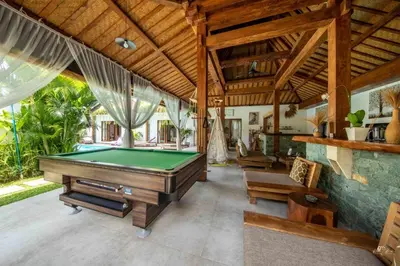 an indoor pool room with a pool table at Elvano villa in heart of seminyak and near beach in Seminyak