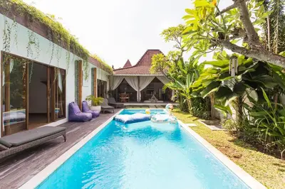 a swimming pool in the backyard of a house at Elvano villa in heart of seminyak and near beach in Seminyak