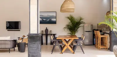 a dining room with a table and chairs at Villa Casa Orana in Seminyak