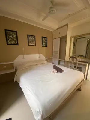 a bedroom with a large white bed in it at Blue Lagoon 5 bedrooms Villa in Kuta