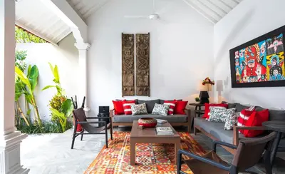 a living room with couches and a table at Villa Tahi - Stylish luxury, tranquil location, walk to beach in Legian