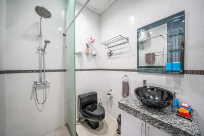 a bathroom with a sink and a toilet at Modern villa with private pool , full kitchen and parking in Legian