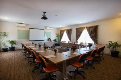a large conference room with a long table and chairs at The Sun Hotel & Spa Legian in Legian